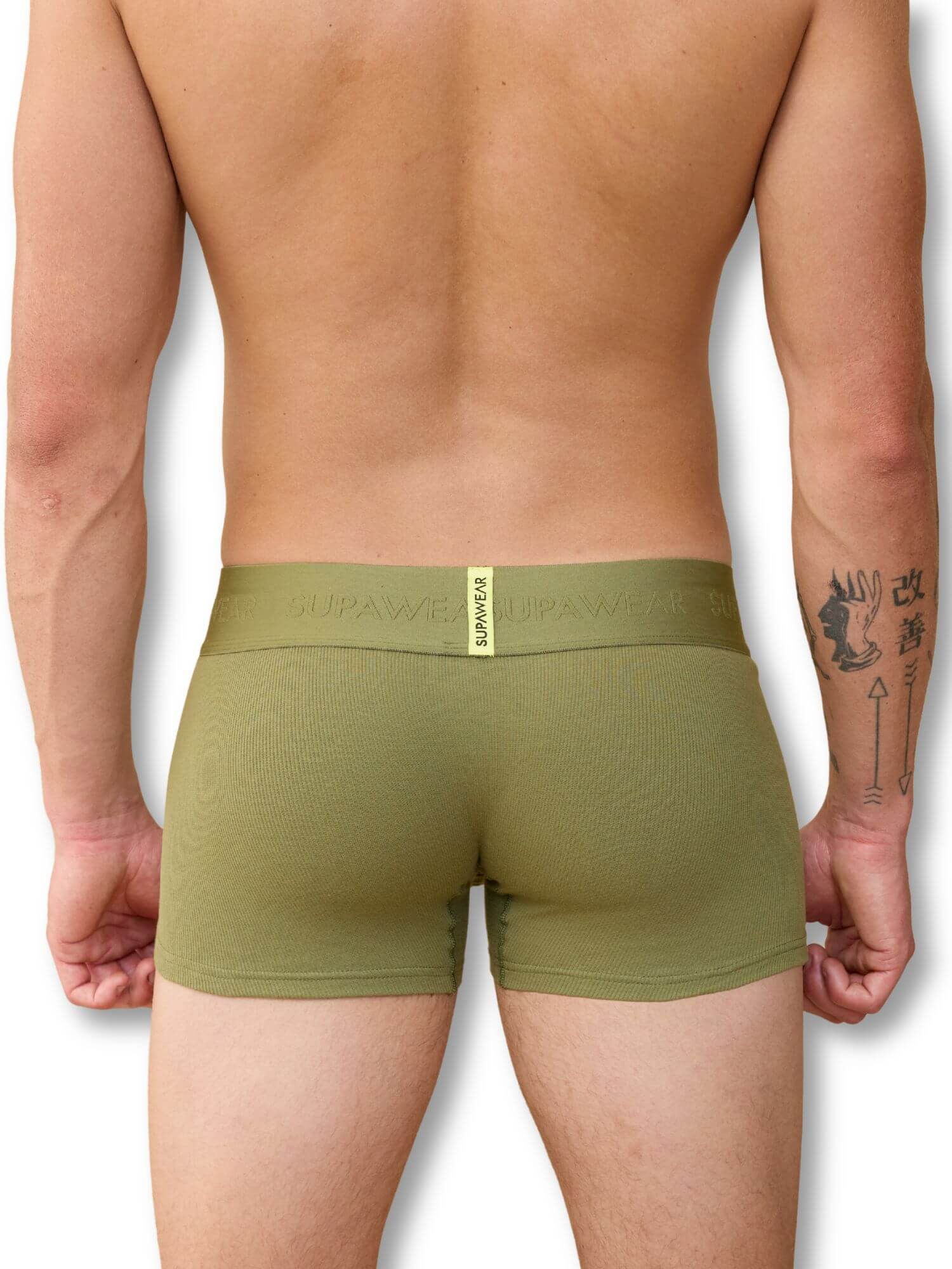 Person wearing olive green boxer briefs with a visible brand logo on a white background